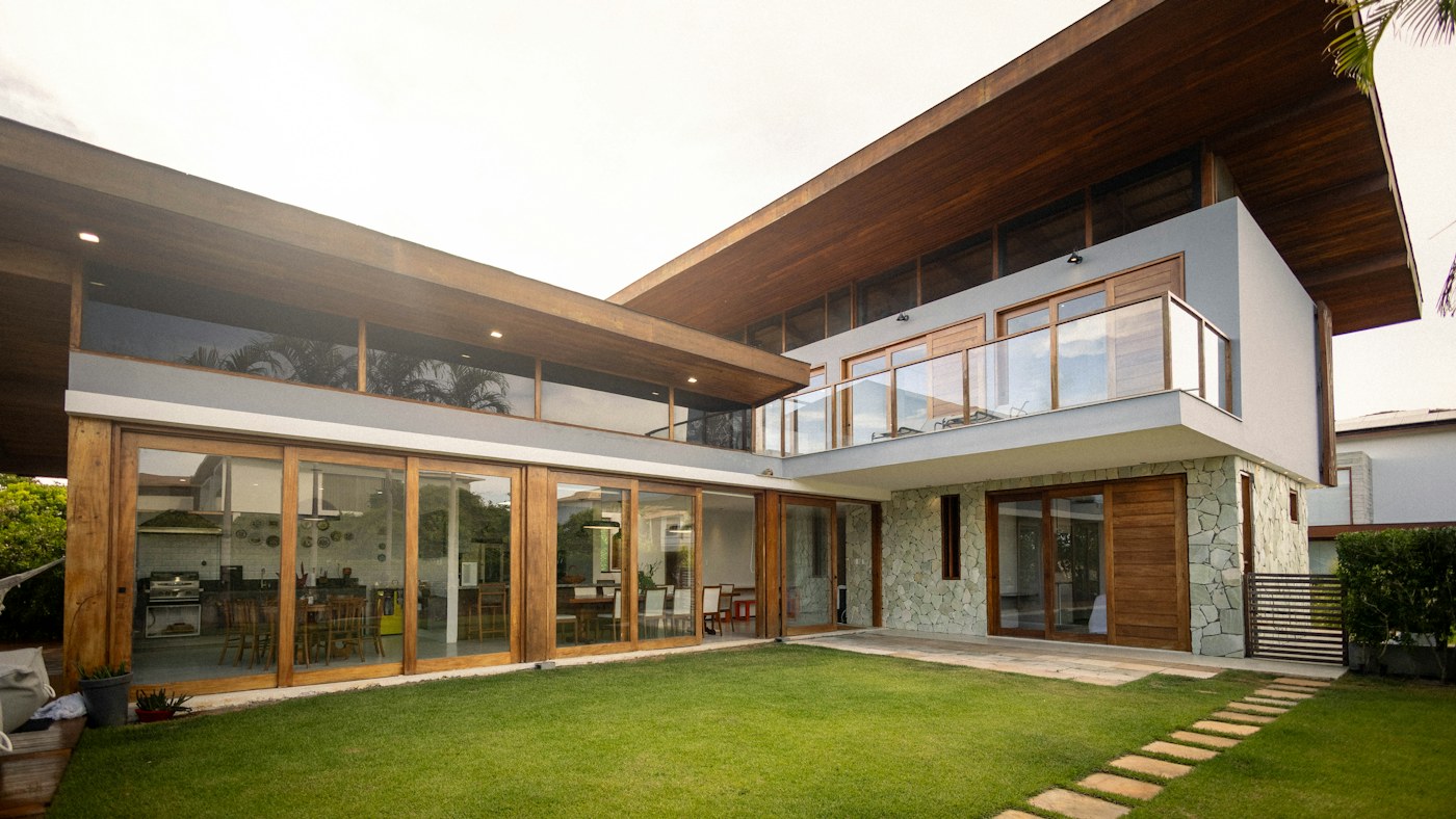 A completed house with a garden and glazed living space